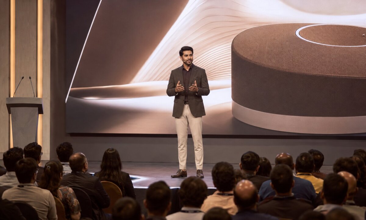 An Indian founder delivering a modern keynote presentation